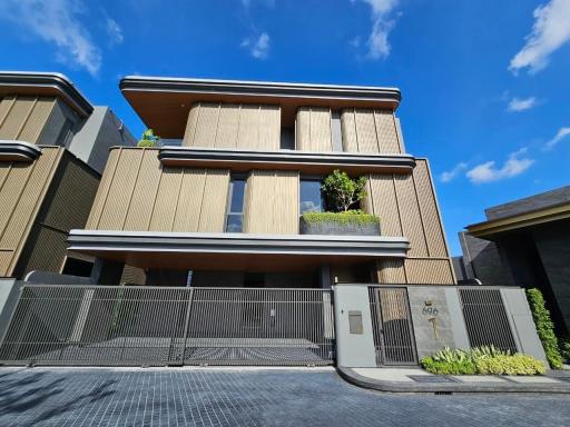 Modern residential building exterior with clear blue sky