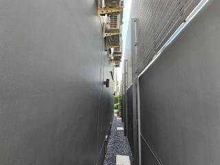 Narrow outdoor alleyway between two buildings