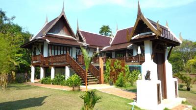 Traditional style house with a lush garden setting