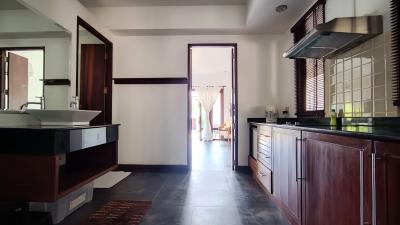 Modern kitchen with wooden cabinets and black countertops