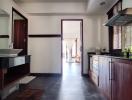 Modern kitchen with wooden cabinets and black countertops