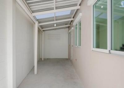 Covered patio space with sunroof and tiled flooring