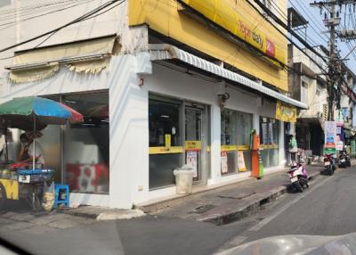 Street view of a commercial building with storefronts