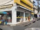 Street view of a commercial building with storefronts