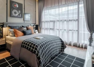 Elegantly furnished bedroom with large bed and stylish decor