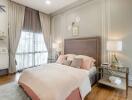 Elegant bedroom with large window and stylish decor