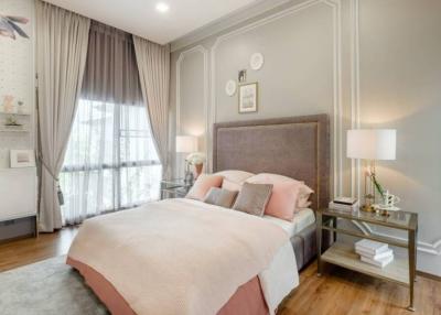 Elegant bedroom with large window and stylish decor