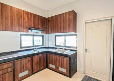 Modern kitchen with wooden cabinets and granite countertops