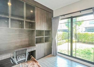 Modern living room with large windows and garden view