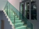 Modern glass balustrade staircase in a contemporary home