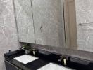 Modern bathroom with double vanity and marble tiles