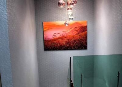 Modern bathroom interior with artistic lighting and wall decor
