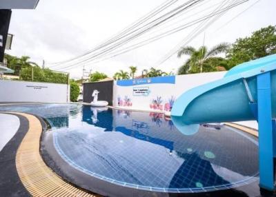 Private pool with waterslide and artistic wall mural