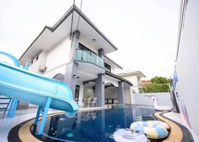 Modern two-story house with a swimming pool and slide