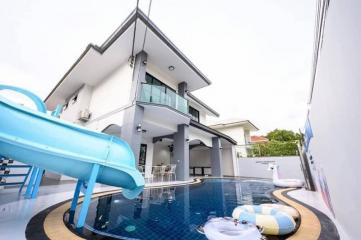 Modern two-story house with a swimming pool and slide