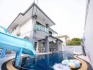 Modern two-story house with a swimming pool and slide