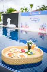 Floating breakfast setup in a private outdoor swimming pool