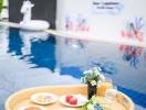 Floating breakfast setup in a private outdoor swimming pool