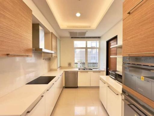 Modern kitchen with stainless steel appliances and wooden cabinets