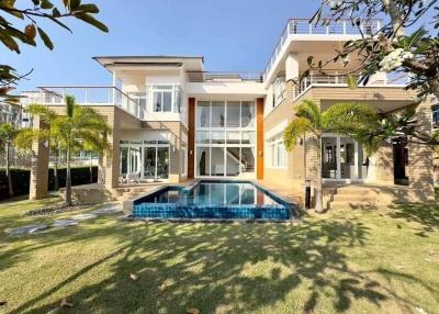 Modern two-story house with swimming pool and garden