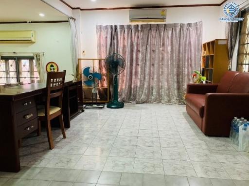 Spacious and well-lit living room with furniture