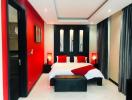 Modern bedroom with bold red accent wall, king-sized bed, and elegant decor