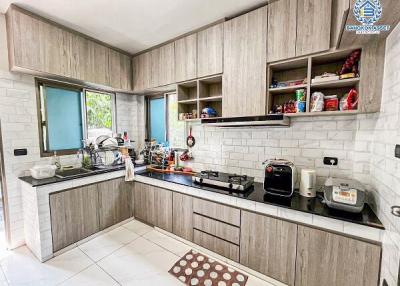 Modern kitchen with built-in cabinets and stainless steel appliances 