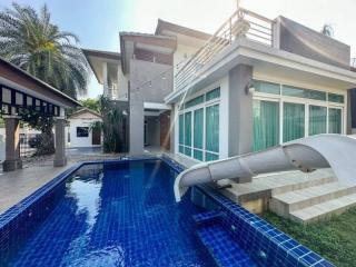 Modern two-story house with a pool and slide