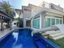 Modern two-story house with a pool and slide
