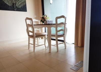 Cozy dining area with table and chairs by the window