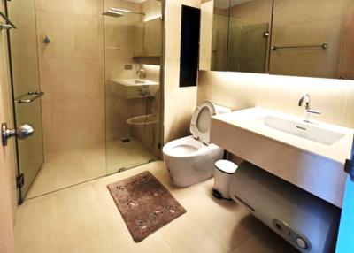 Modern bathroom with walk-in shower and wall-mounted toilet