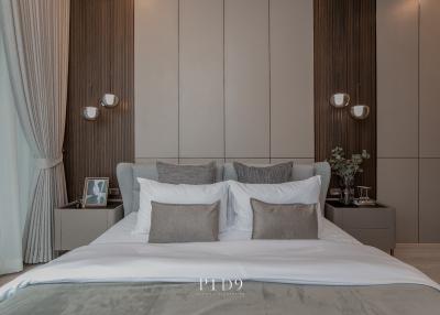 Elegantly decorated modern bedroom with neutral tones and stylish bedding