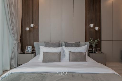 Elegantly decorated modern bedroom with neutral tones and stylish bedding