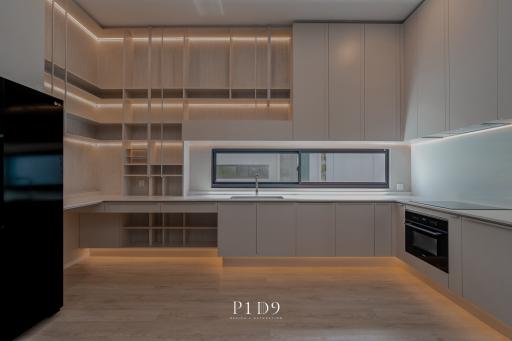 Modern kitchen with integrated appliances and LED lighting