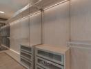 Modern walk-in closet with built-in lighting and shelving