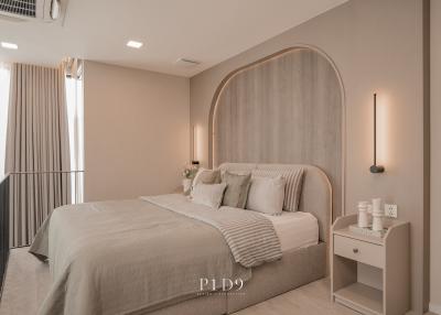 Modern and cozy bedroom with neutral color scheme and elegant decor