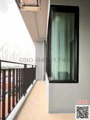Spacious balcony with railing and air conditioning unit