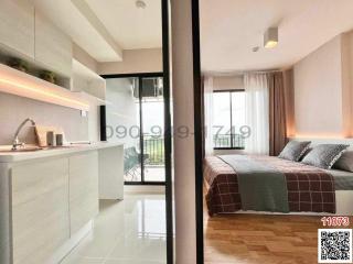 Modern bedroom with adjoining balcony and kitchenette