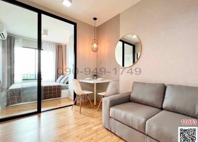 Modern living room with adjoining bedroom