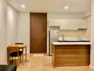 Modern kitchen with wooden finish and dining area