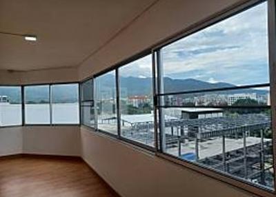Spacious living room with panoramic windows and mountain view