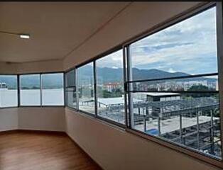 Spacious living room with panoramic windows and mountain view