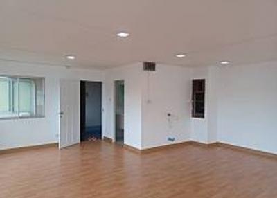 Spacious empty living room with hardwood flooring