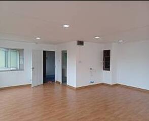 Spacious empty living room with hardwood flooring