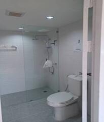 Modern bathroom interior with shower and toilet