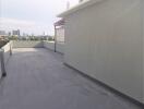 Spacious roof deck with urban skyline view
