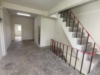 Spacious empty interior of a building with staircase