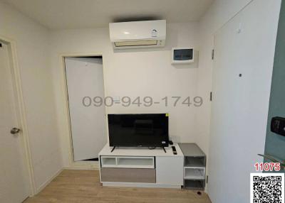 Compact living room with air conditioning and entertainment unit