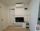 Compact living room with air conditioning and entertainment unit