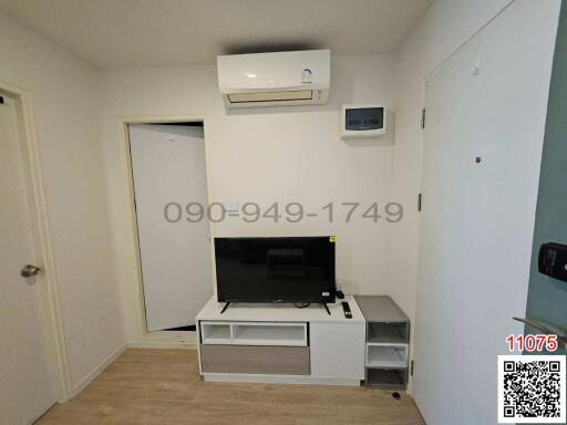 Compact living room with air conditioning and entertainment unit